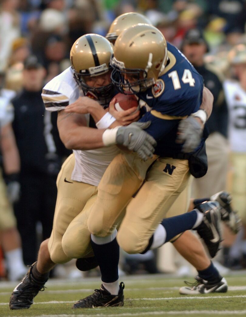 An American football quarterback preparing to throw