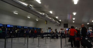 Passengers moving through an airport terminal