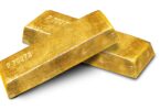 Stacked gold bars in a secure vault