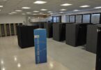 Rows of supercomputer cabinets in a data centre hall