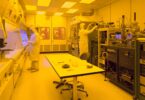 Semiconductor cleanroom engineers working on silicon wafer production lines